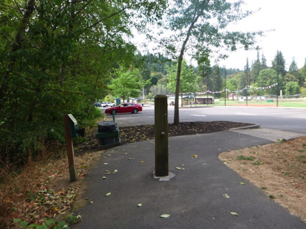 Exiting the paved loops near the park at entrance and parking